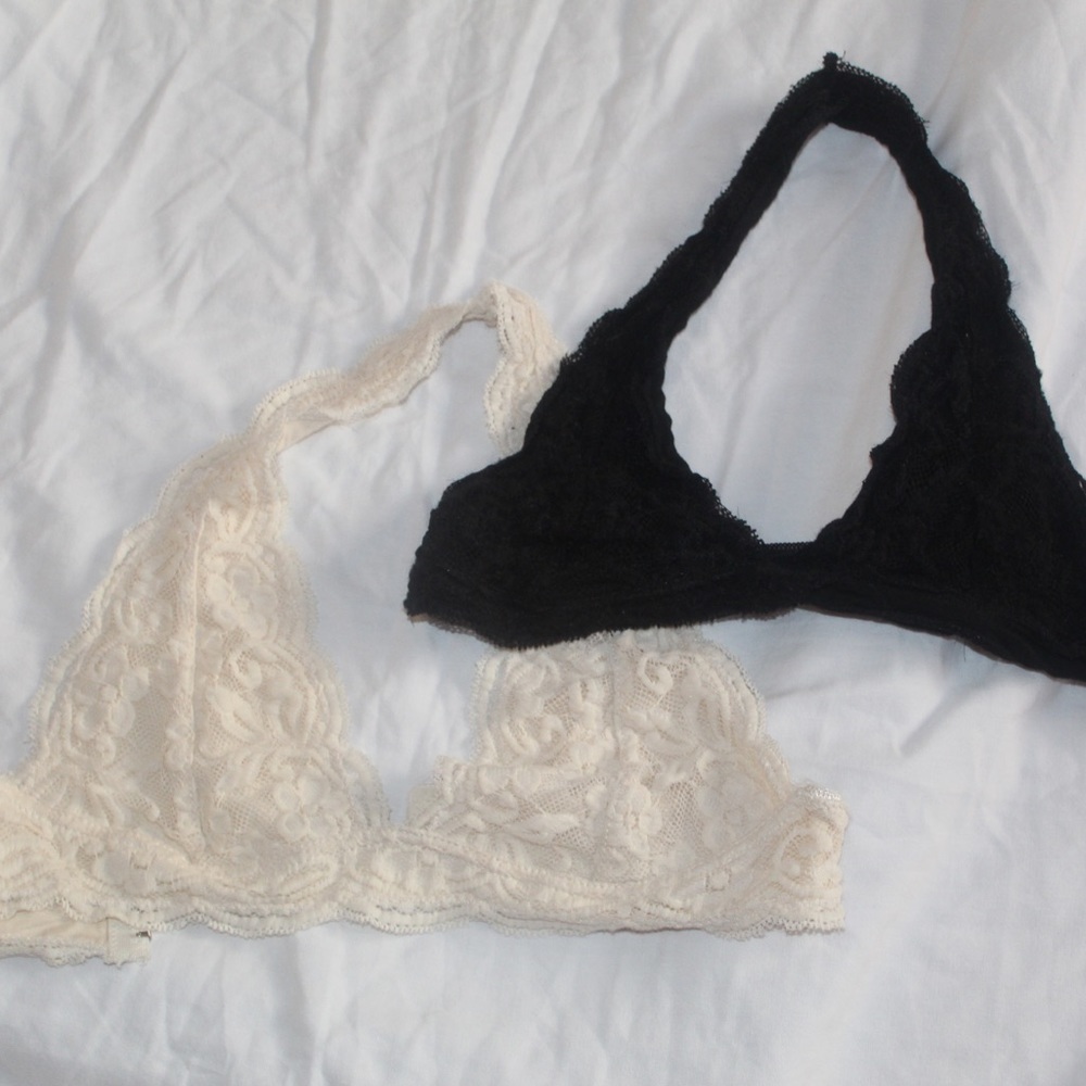 a set of black and creme bralettes🥰